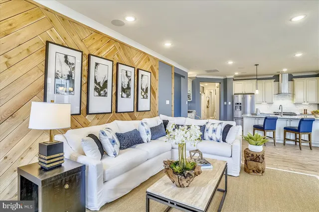 a living room with furniture and a painting