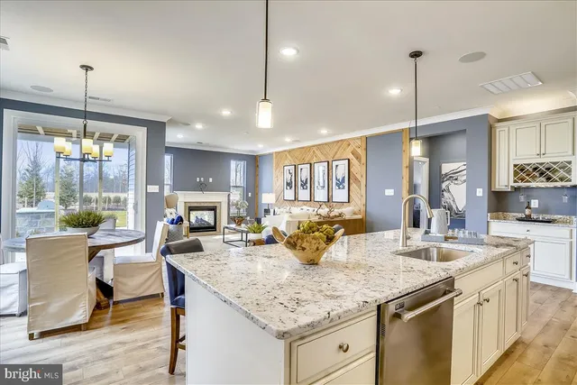 a kitchen with center island a sink appliances and a counter top space