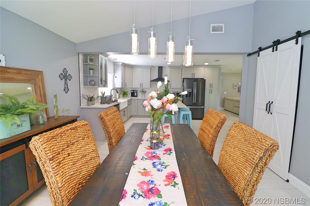 129 Rhode Island Street Edgewater, FL 32132 - Photo 11 of 49 a living room with furniture fireplace and wooden floor