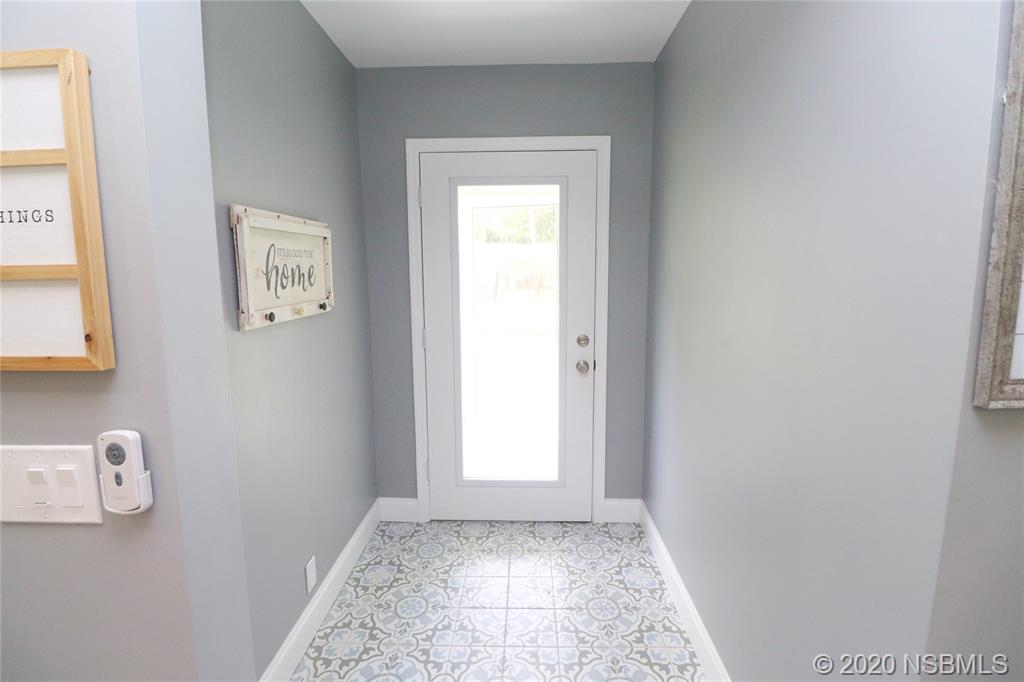129 Rhode Island Street Edgewater, FL 32132 - Photo 17 of 49 a view of an empty room with a window