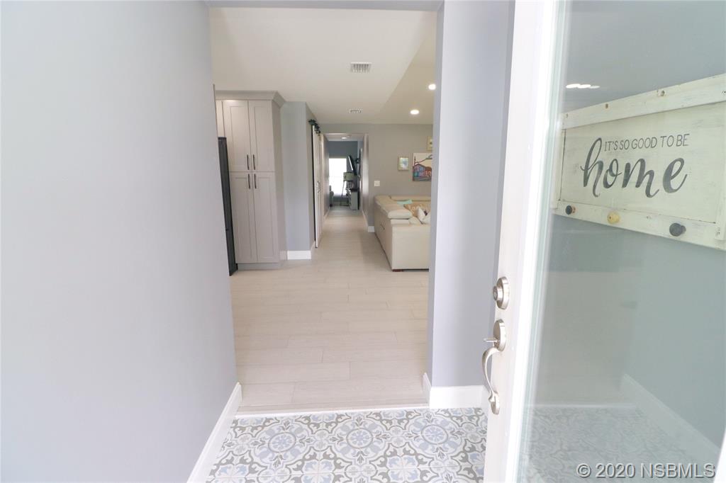 129 Rhode Island Street Edgewater, FL 32132 - Photo 3 of 49 a view of a hallway with bathroom