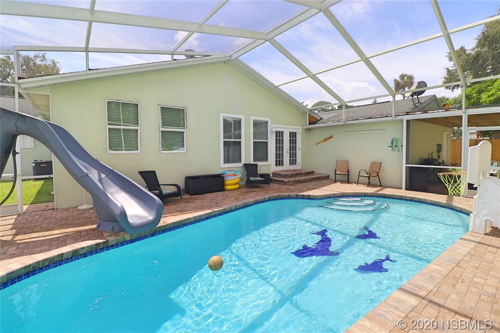 129 Rhode Island Street Edgewater, FL 32132 - Photo 39 of 49 a swimming pool with outdoor seating yard and furniture