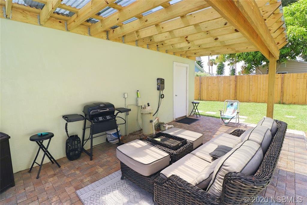 129 Rhode Island Street Edgewater, FL 32132 - Photo 41 of 49 a view of a tables and chairs in patio