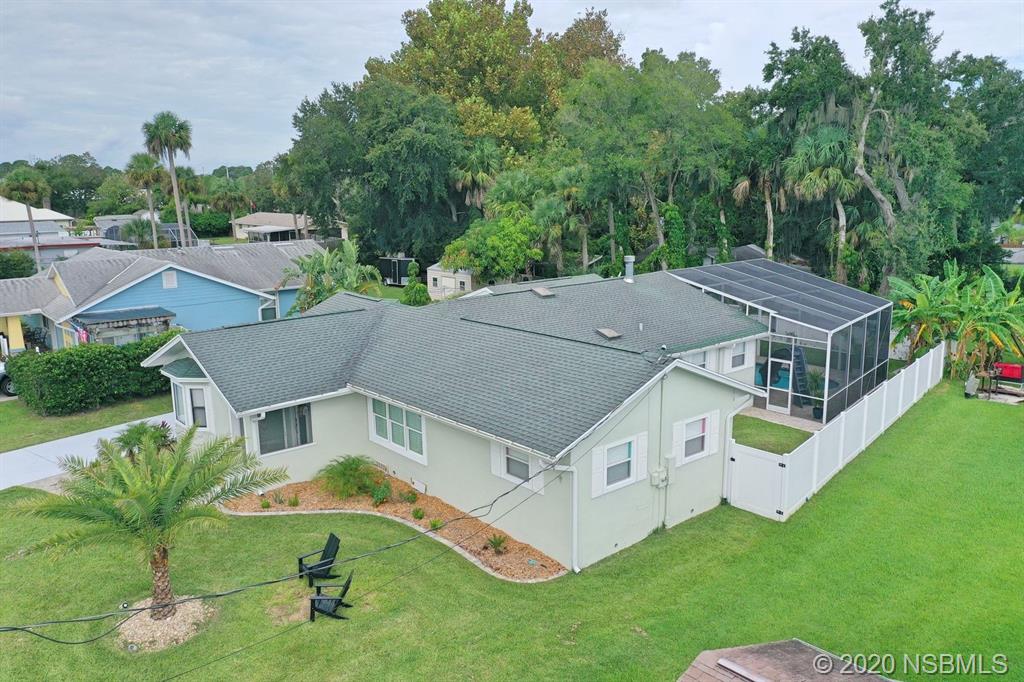 129 Rhode Island Street Edgewater, FL 32132 - Photo 45 of 49 an aerial view of a house with a yard