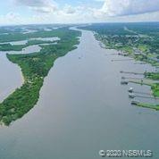 129 Rhode Island Street Edgewater, FL 32132 - Photo 46 of 49 a view of a lake with a big yard