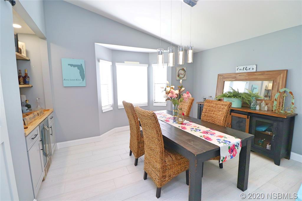 129 Rhode Island Street Edgewater, FL 32132 - Photo 8 of 49 a dining room with furniture and window