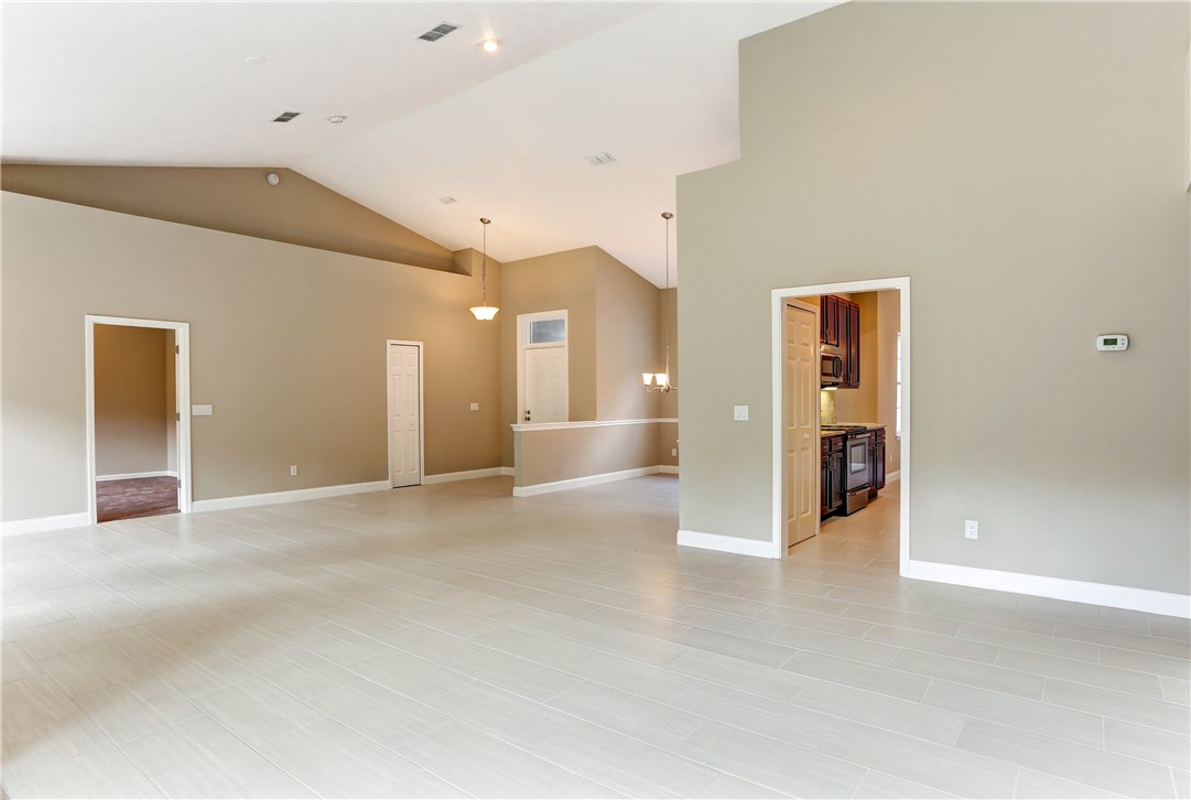 96921 Blackrock Road Yulee, FL 32097 - Photo 11 of 34 a view of a hallway with wooden shelves