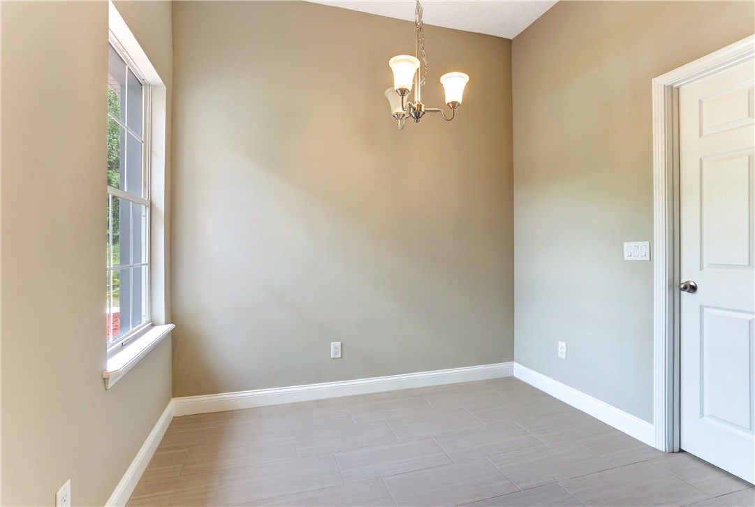 96921 Blackrock Road Yulee, FL 32097 - Photo 17 of 34 a view of an empty room with a window