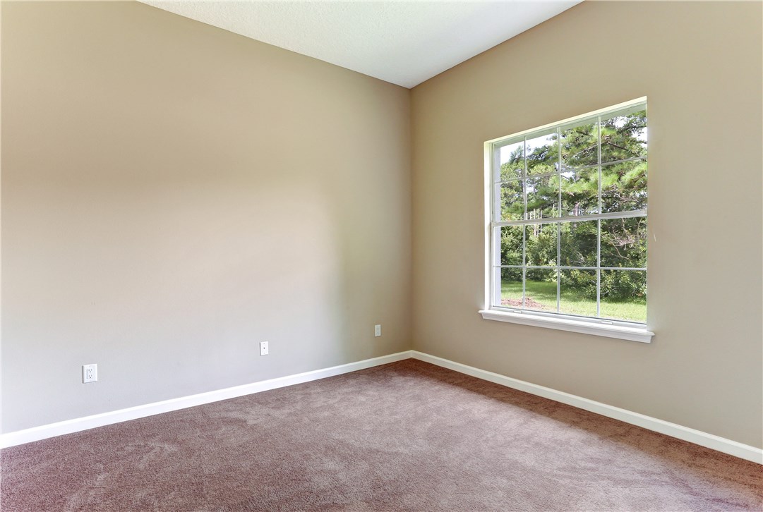 96921 Blackrock Road Yulee, FL 32097 - Photo 22 of 34 an empty room with a window