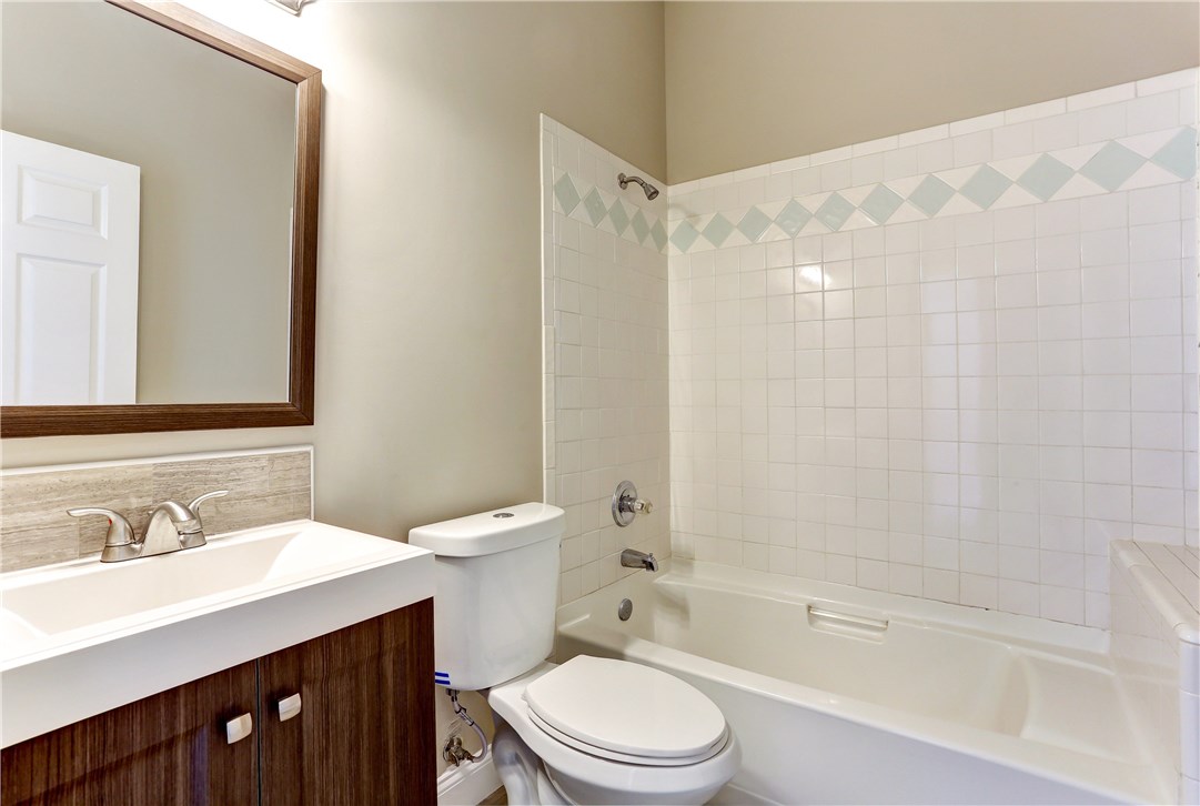 96921 Blackrock Road Yulee, FL 32097 - Photo 23 of 34 a bathroom with a sink a toilet and shower