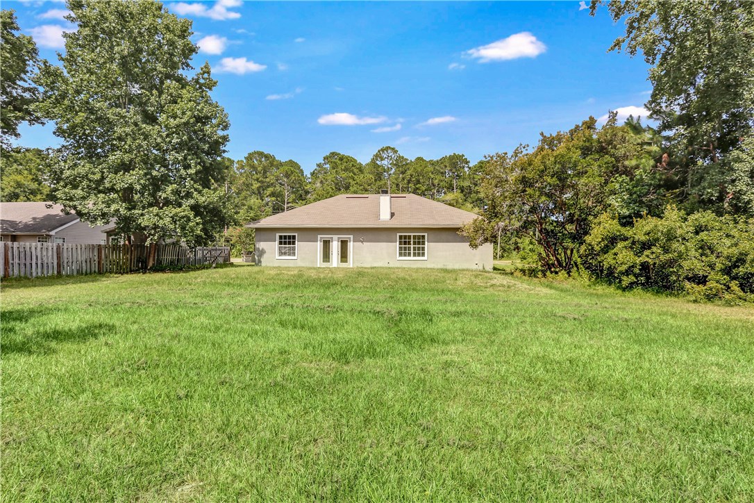 96921 Blackrock Road Yulee, FL 32097 - Photo 32 of 34 a front view of a house with garden