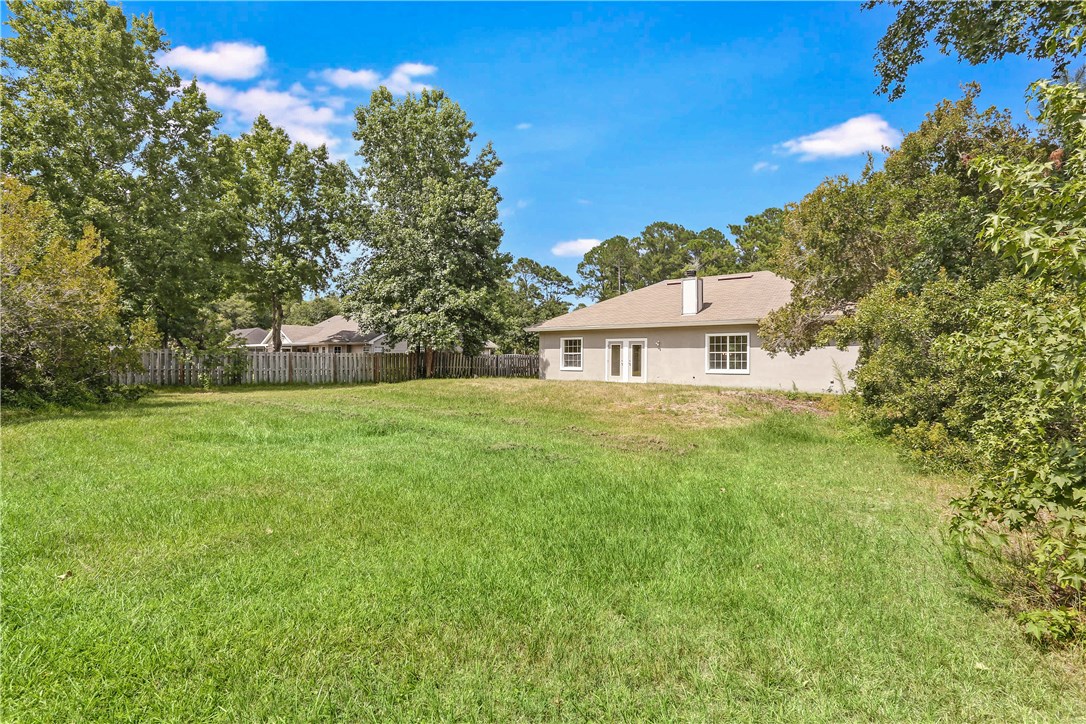96921 Blackrock Road Yulee, FL 32097 - Photo 33 of 34 a house view with a garden space