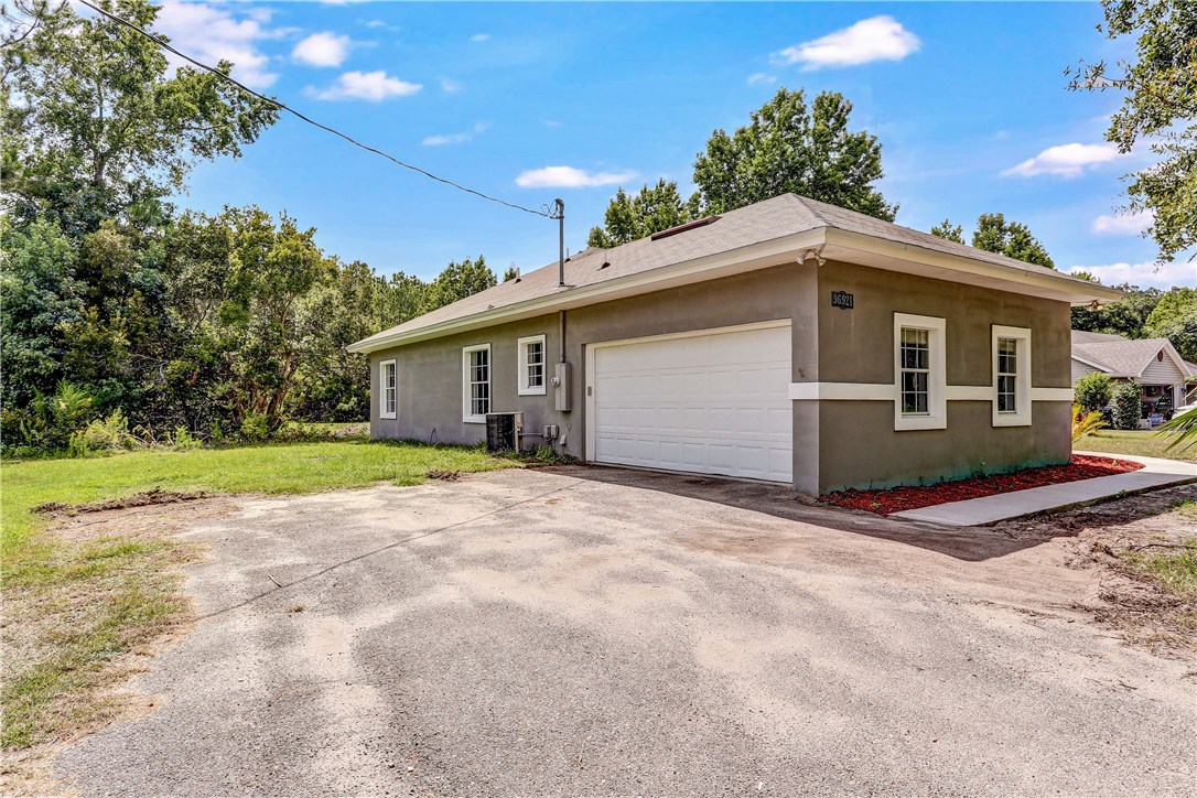 96921 Blackrock Road Yulee, FL 32097 - Photo 34 of 34 a view of a house with a yard