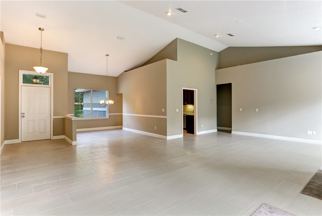 96921 Blackrock Road Yulee, FL 32097 - Photo 10 of 34 a view of an empty room with kitchen and a window