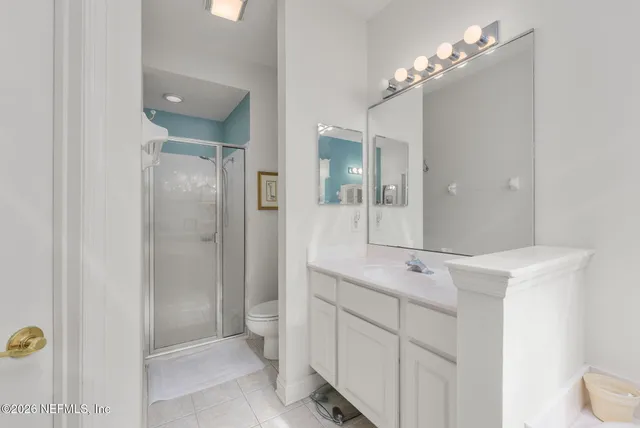 a kitchen with white cabinets appliances and a sink