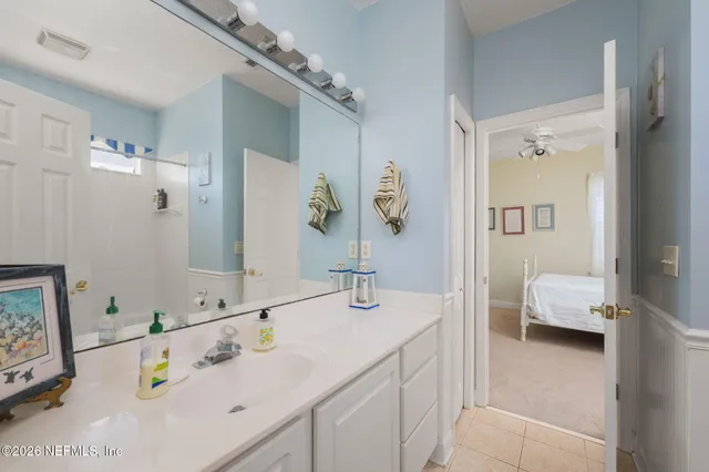 a bedroom with a bed and a book shelf