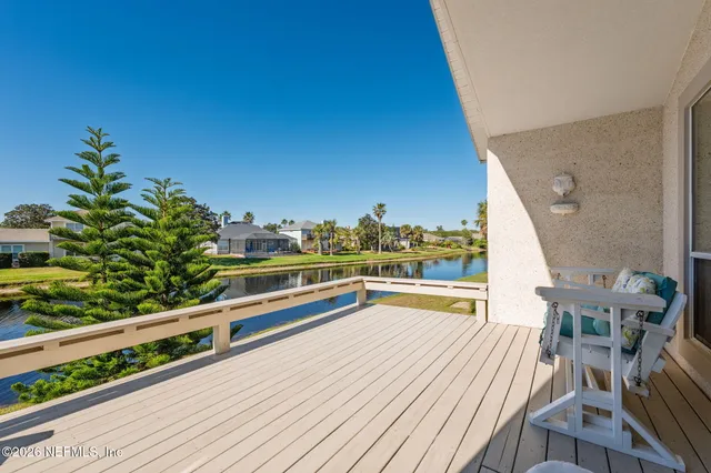 a view of a chairs and table in a balcony