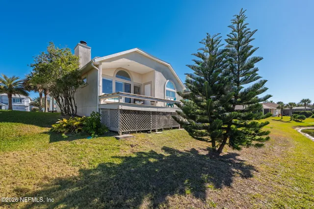 an aerial view of a house with a garden