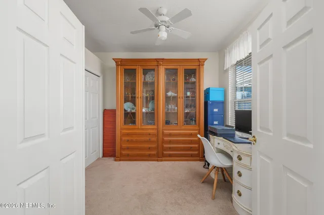 a view of empty room with shelves
