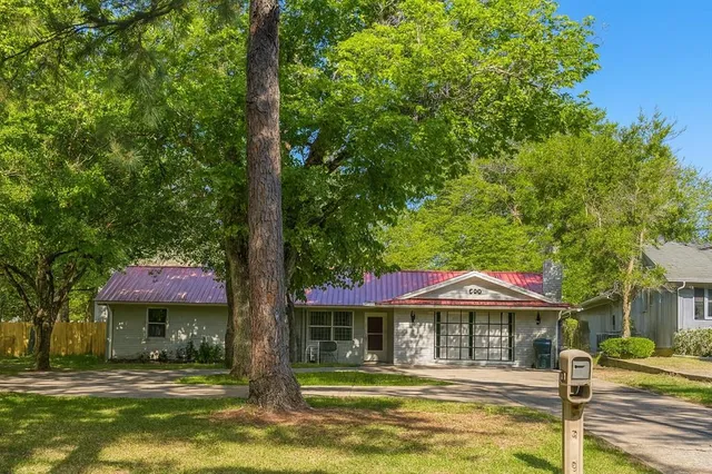 a front view of a building with garden