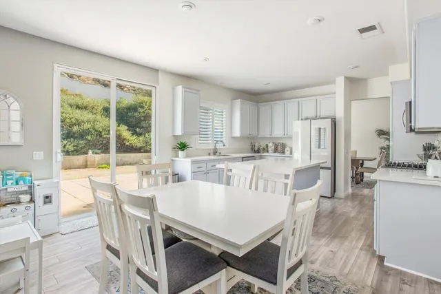 a view of a dining room with furniture window and outside view