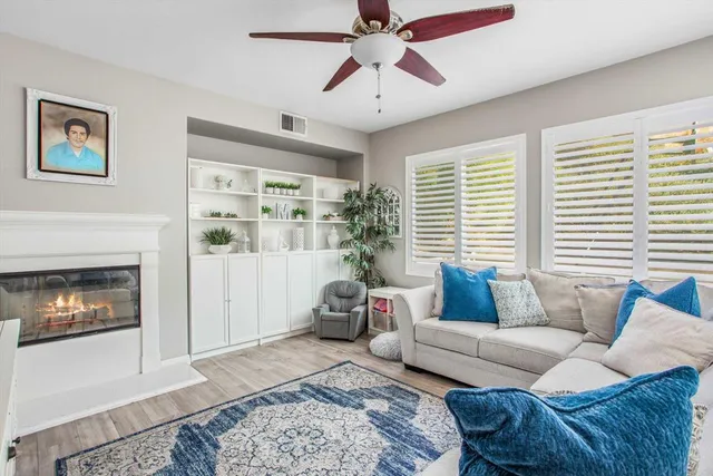 a living room with furniture and a fireplace