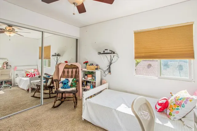 a bedroom with furniture and a window