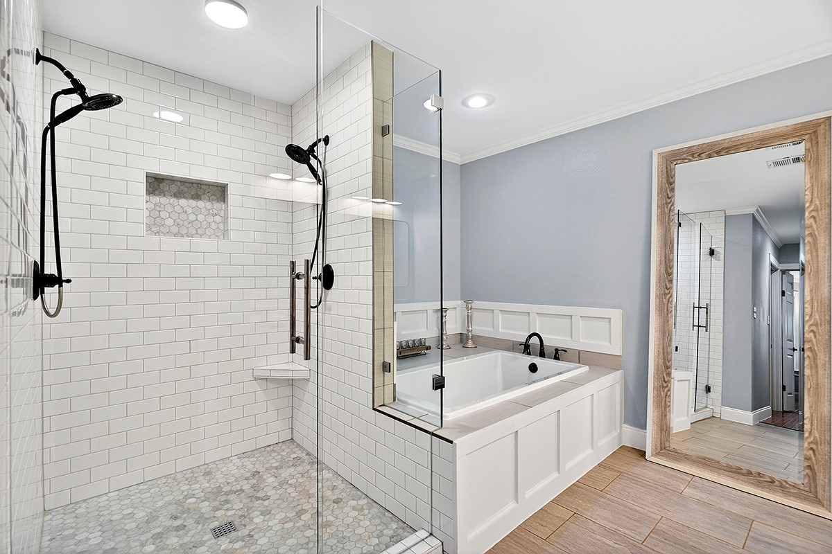 301 Medlin Creek Loop Dripping Springs, TX 78620 - Photo 16 of 40 a white bath tub sitting next to a shower