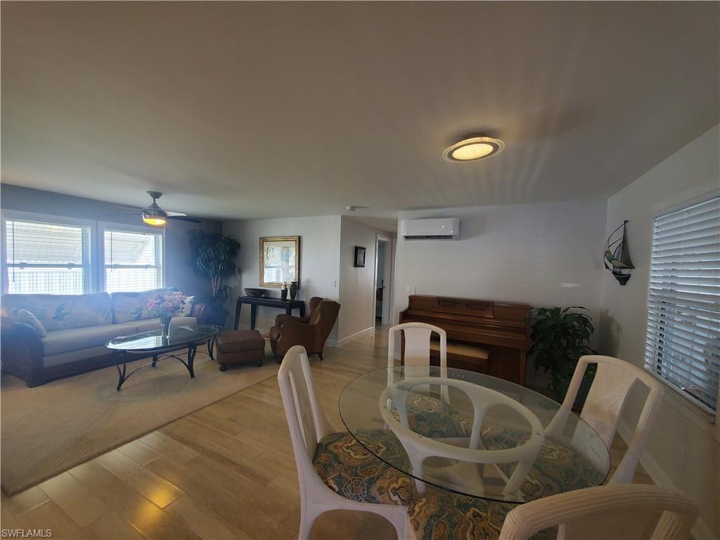 7 Topaz Lane, Unit T7 Naples, FL 34112 - Photo 12 of 23 a living room with furniture and wooden floor