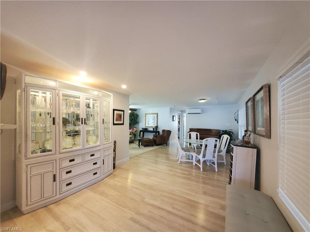7 Topaz Lane, Unit T7 Naples, FL 34112 - Photo 5 of 23 a living room with furniture and a flat screen tv