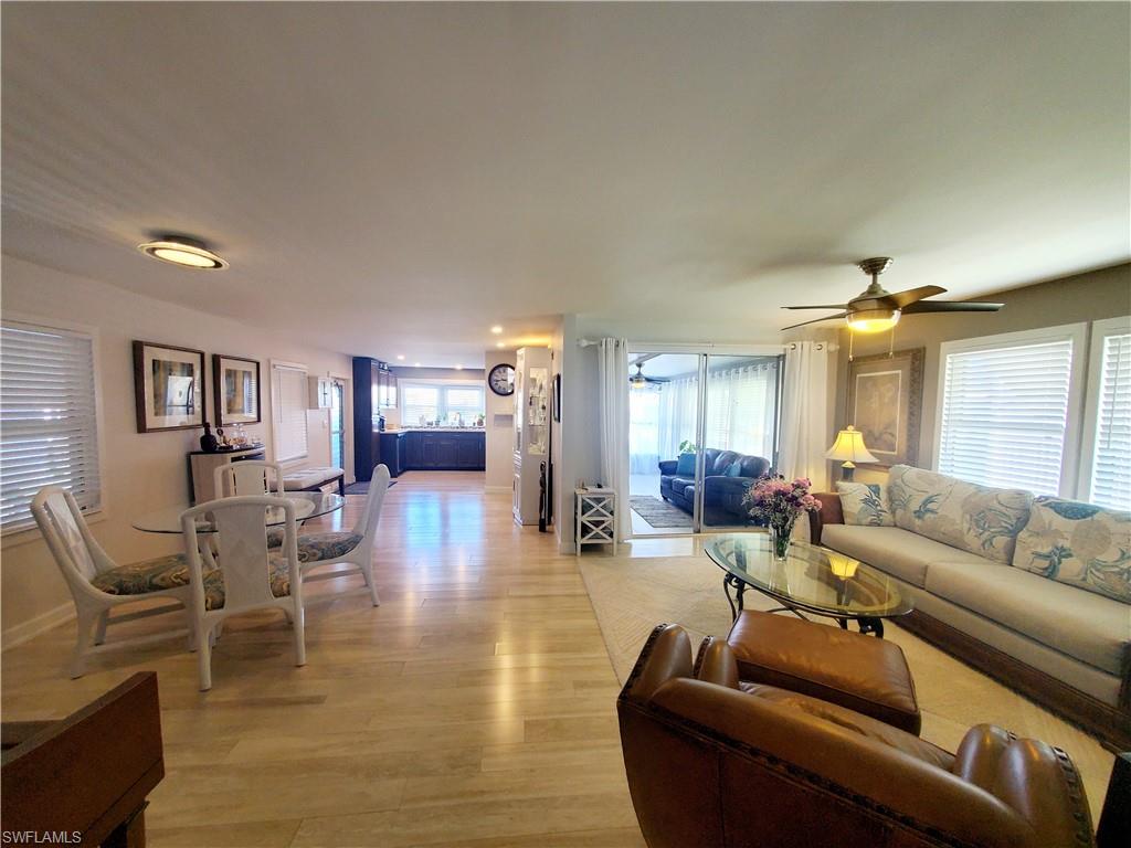 7 Topaz Lane, Unit T7 Naples, FL 34112 - Photo 6 of 23 a living room with furniture and wooden floor