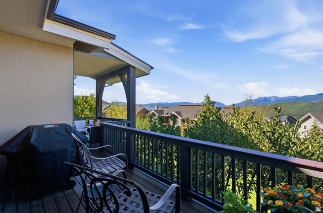5207 North Oldgate Road Heber City, UT 84032 - Photo 25 of 58 Covered outdoor balcony with wood decking and painted railing