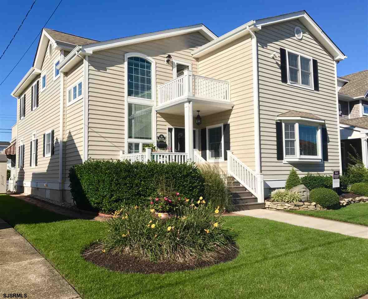 Nicely landscaped front yard w/paver'd side yard/walkway to rear of home.