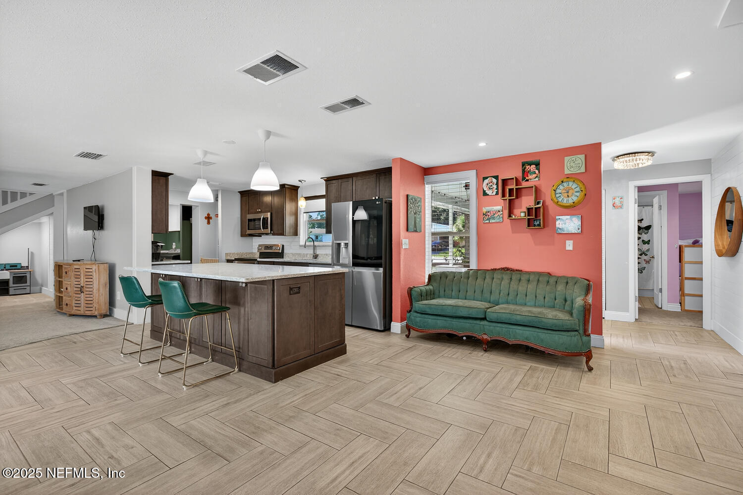 214 Deltona Boulevard St. Augustine, FL 32086 - Photo 13 of 23 a living room with furniture and kitchen view