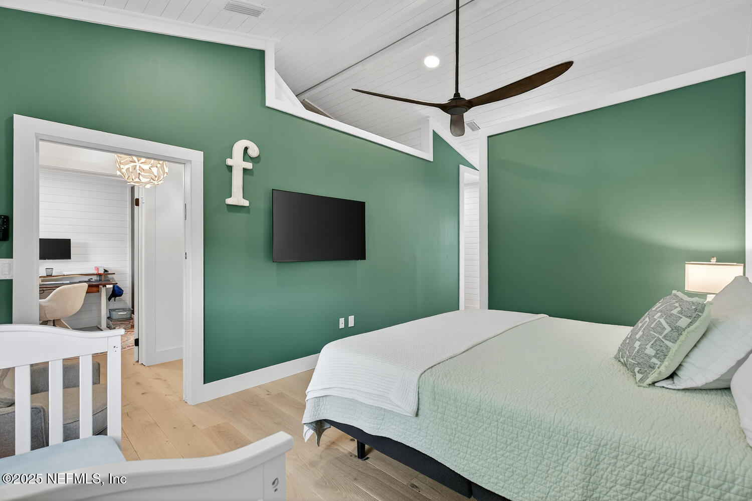 214 Deltona Boulevard St. Augustine, FL 32086 - Photo 17 of 23 a bedroom with a bed and a flat screen tv