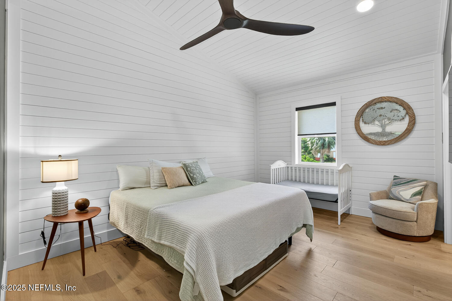 214 Deltona Boulevard St. Augustine, FL 32086 - Photo 18 of 23 a bedroom with a bed and a lamp on dresser