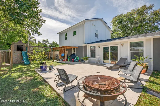 a view of a house with backyard porch and patio
