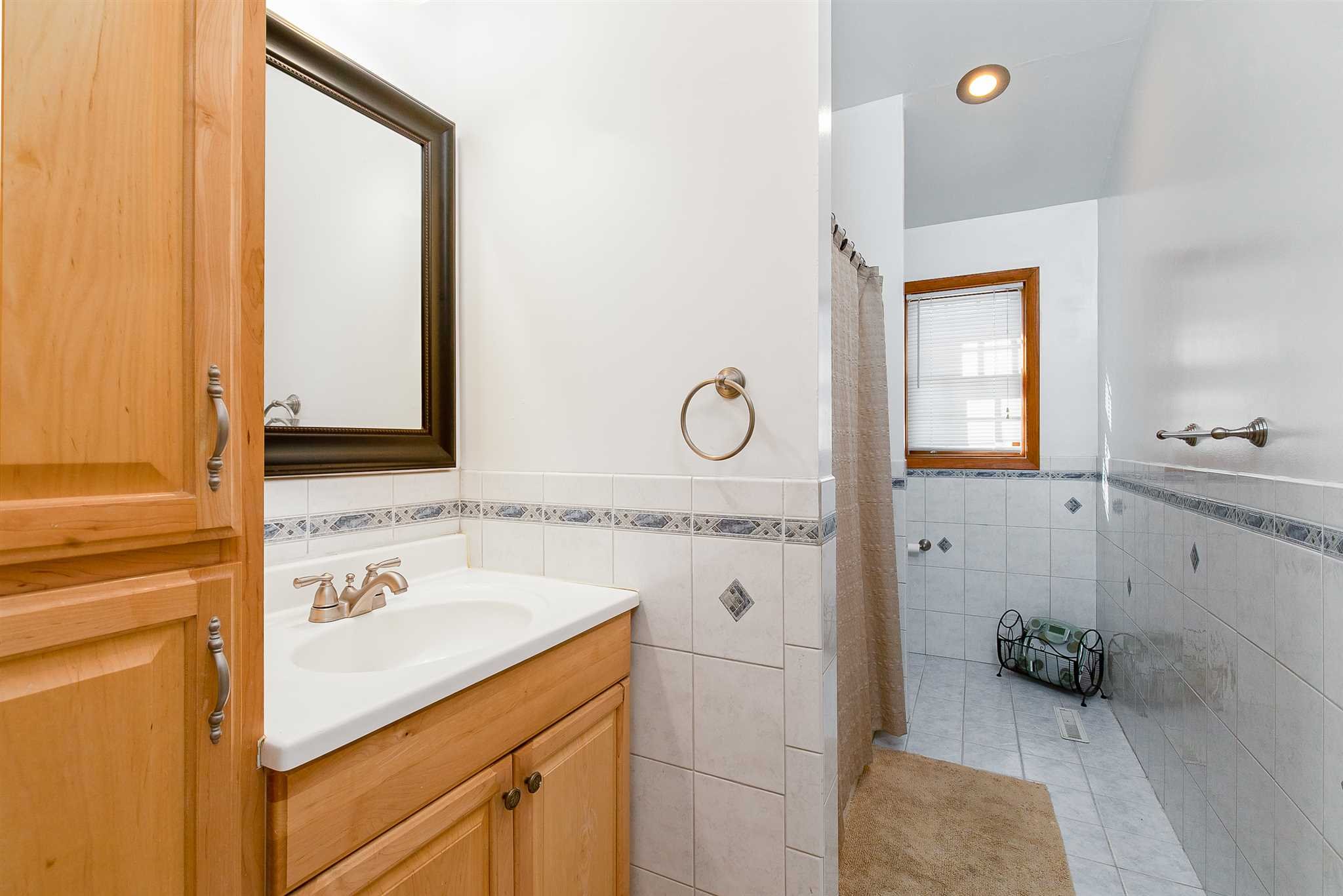 15 Meier Road LaGrange, NY 12603 - Photo 16 of 26 a bathroom with a sink a mirror and a shower
