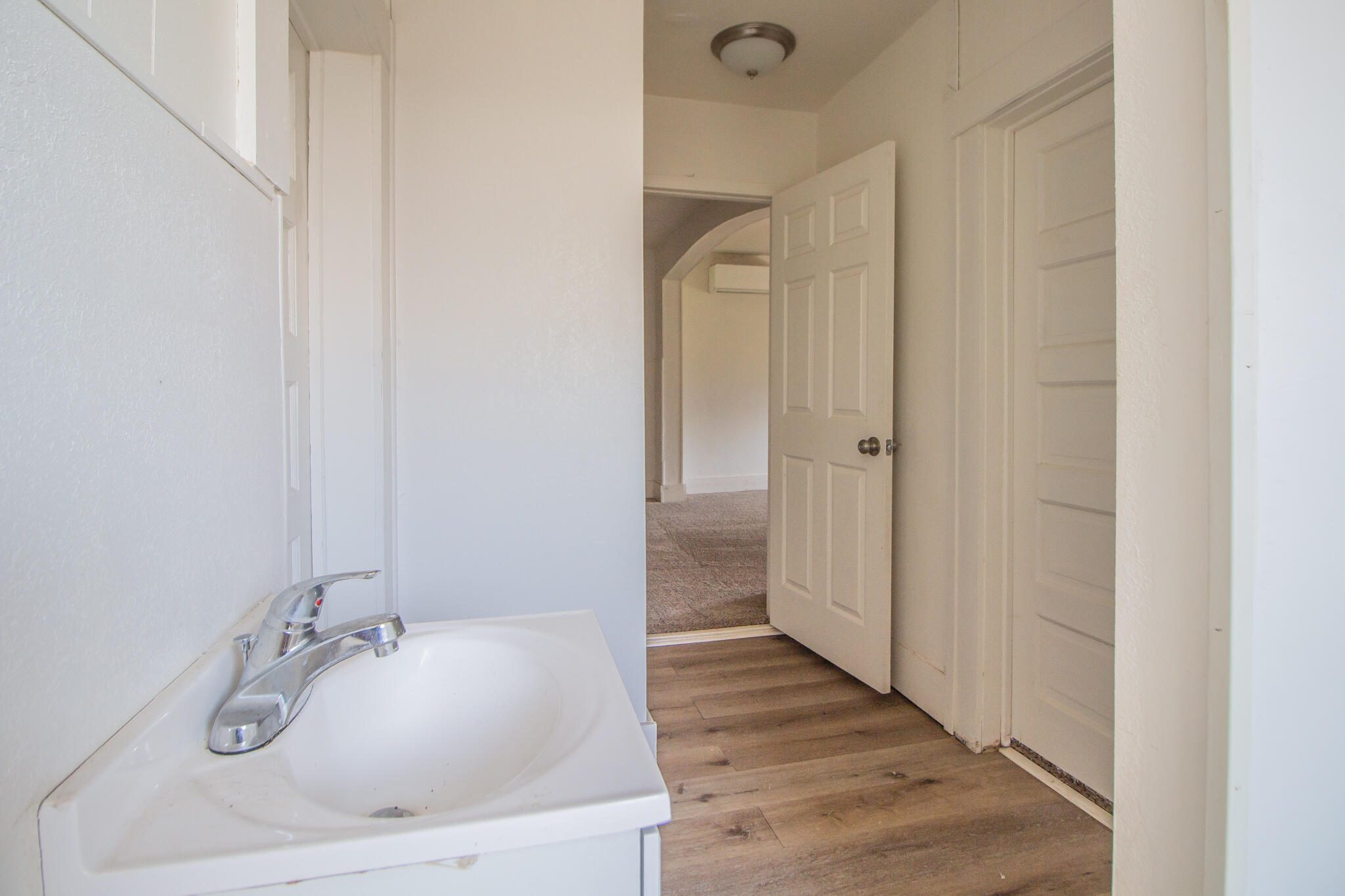 315 South 13th Street Slaton, TX 79364 - Photo 12 of 14 a bathroom with a sink and a tub