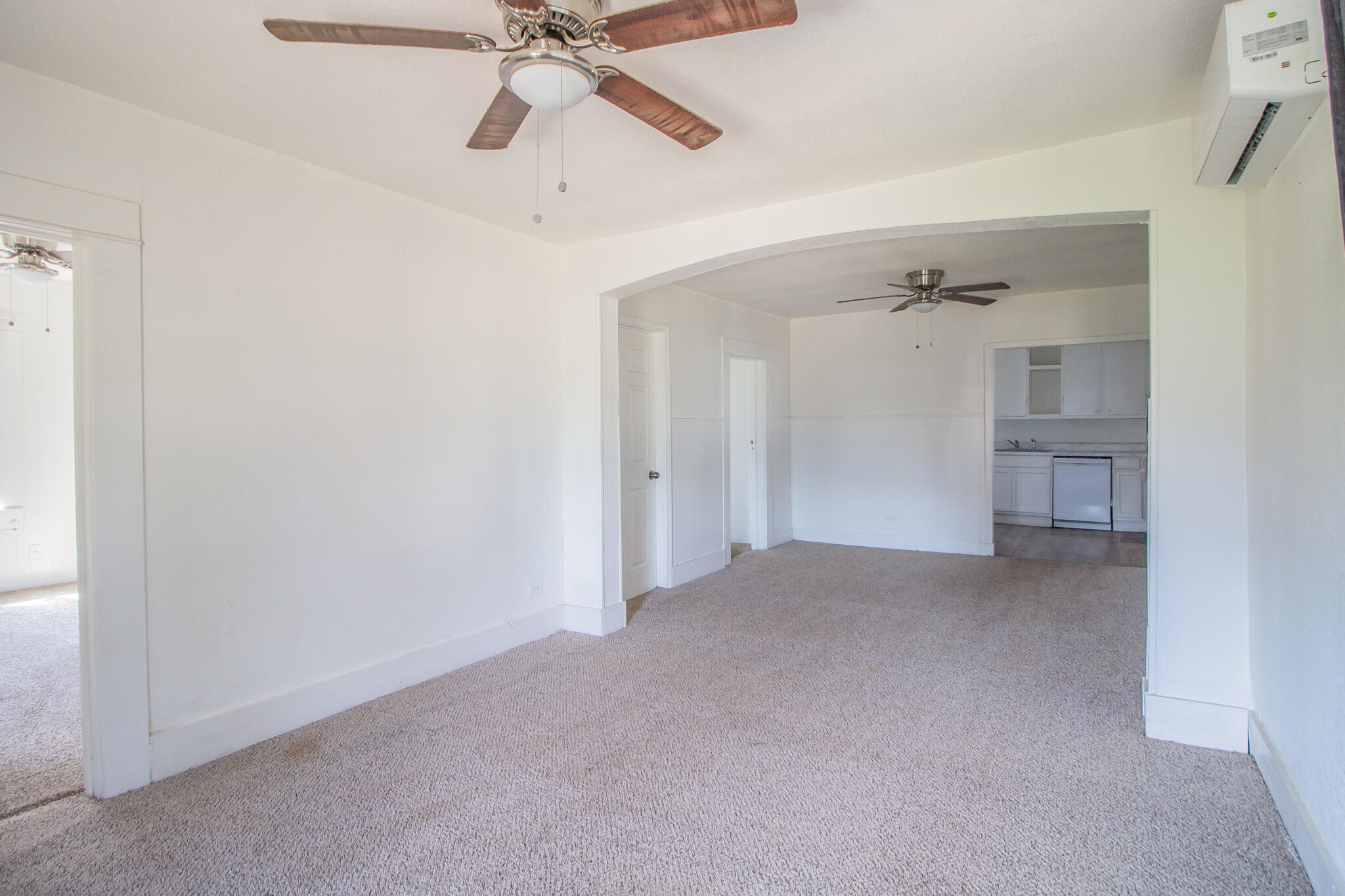 315 South 13th Street Slaton, TX 79364 - Photo 4 of 14 a view of an empty room and chandelier fan