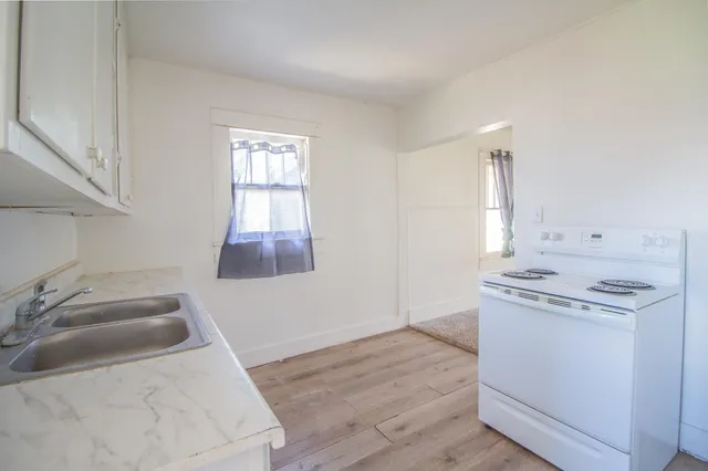 a kitchen with a stove and a sink