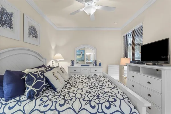 a bedroom with furniture and flat screen tv