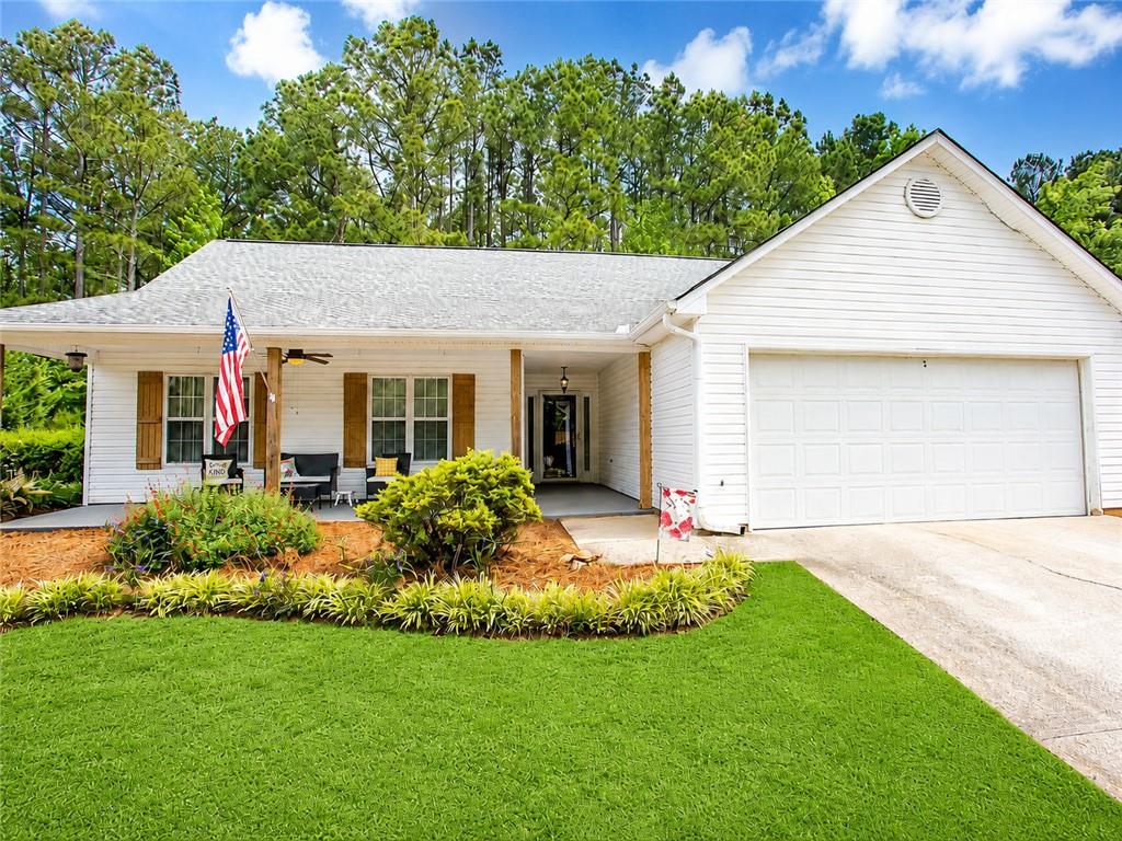 a front view of house with yard and green space