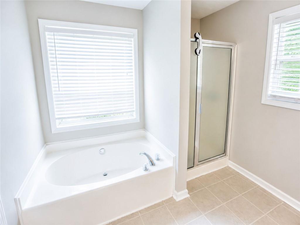 205 Richmond Hill Road Monroe, GA 30655 - Photo 12 of 15 a white bath tub sitting next to a window