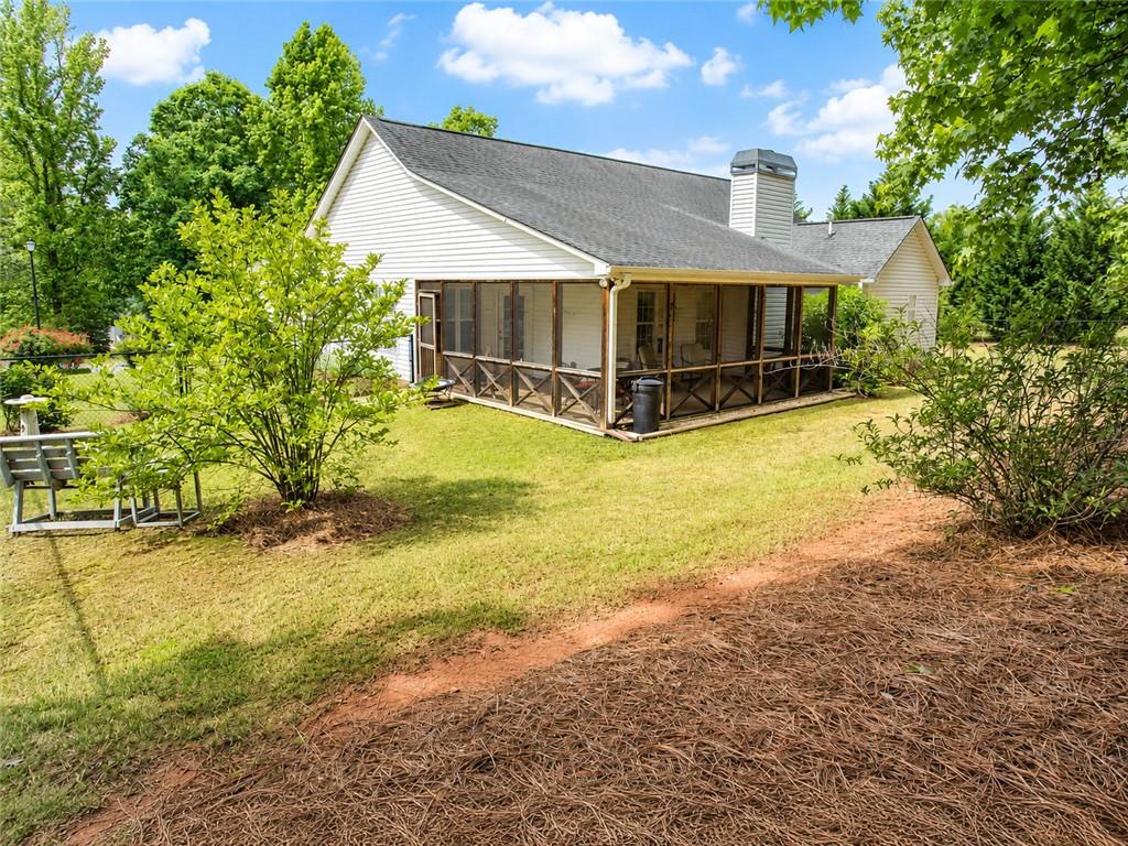 205 Richmond Hill Road Monroe, GA 30655 - Photo 2 of 15 a front view of house with yard and trees in the background