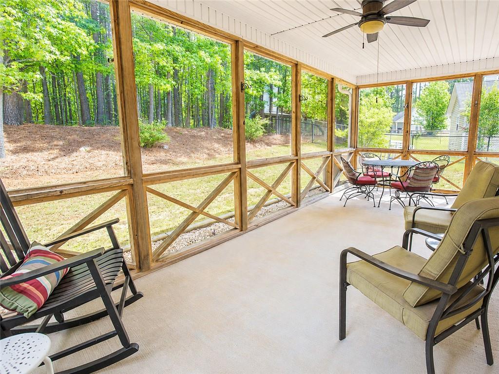 205 Richmond Hill Road Monroe, GA 30655 - Photo 5 of 15 a view of a swimming pool with a couch and chairs
