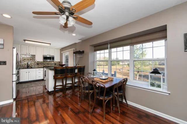 a workspace with furniture and wooden floor