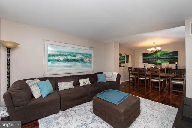 a living room with furniture flat screen tv and a fireplace
