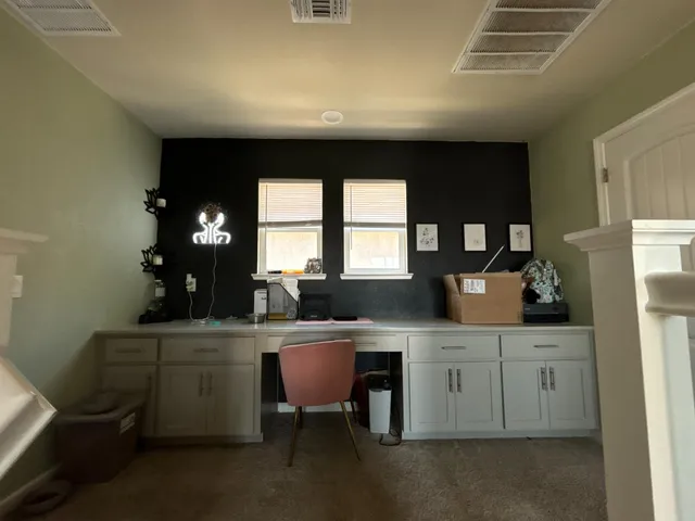 a kitchen with a sink cabinets and a window