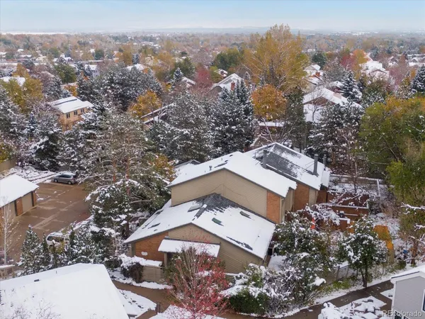 an aerial view of a house with a yard